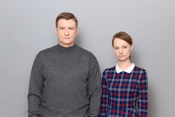 Obraz premium Portrait of man and woman with serious expression on faces