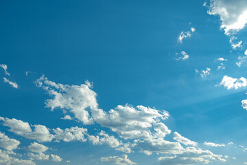blue sky background with small white clouds