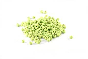 Beads spread on white background. Background or texture of beads. Close up, macro,It is used in finishing fashion clothes. make bead necklace or beads for woman of fashion,Bead Crochet. Daily Beading.