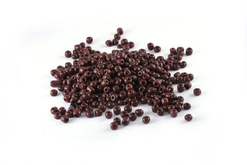 Beads spread on white background. Background or texture of beads. Close up, macro,It is used in finishing fashion clothes. make bead necklace or beads for woman of fashion,Bead Crochet. Daily Beading.