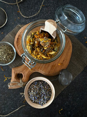 Calendula flowers in a glass jar. Useful herbal tea to boost immunity.