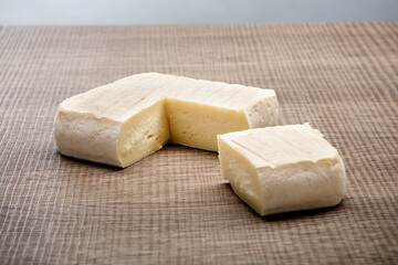 Italian aged cheese on wooden background