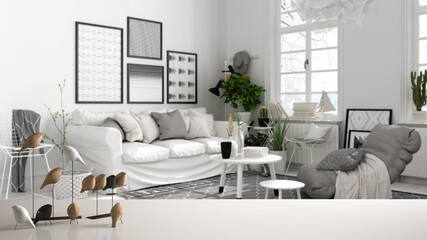 White table top or shelf with minimalistic bird ornament, birdie knick - knack over blurred contemporary white modern living room with sofa and coffee tables, modern interior design