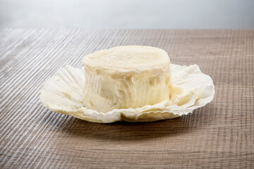 Italian aged cheese on wooden background