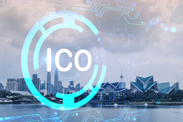ICO icon hologram over panorama city view of Kuala Lumpur. KL is the hub of blockchain projects in...