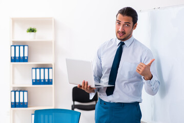 Fototapeta premium Young male employee in business presentation concept