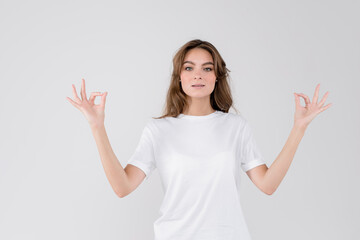 Woman showing thumbs up, isolated on white background, showing appeasement emotions