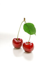 Cherries red fruits with leaf isolated on white background