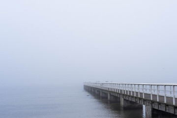 Fototapeta na wymiar Pier ending in mist Malmö