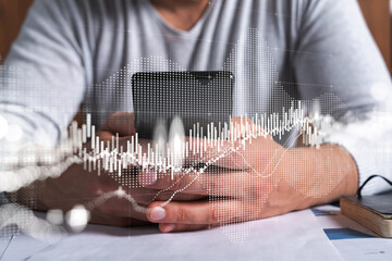 Man using phone. Hands typing smartphone. Double exposure with forex graph hologram. Close up....