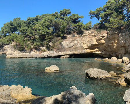 Picturesque rocky coast of the sea. Beautiful Adriatic turquoise sea waters. Mediterranean summer. Blue lagoon.