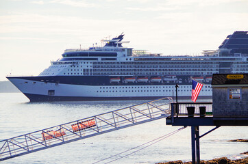 Modern luxury cruiseship or cruise ship liner anchoring on blue sea in bay offshore of Bar Harbor,...