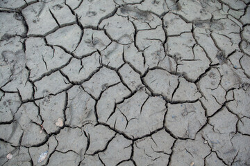 Bottom of the dry river. Climate change on the Earth. Broken earth. Dry season.