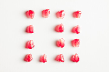 pomegranates square group of seeds isolated on white background