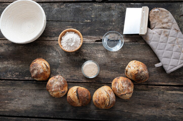 Smiling face made of freshly baked sourdough bread buns and ingredients