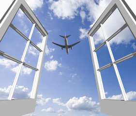 窓から旅客機と雲