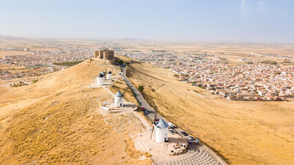 aerial views of consuegra windmills and town at background