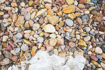 Variety of stones in a stone shore in the coast