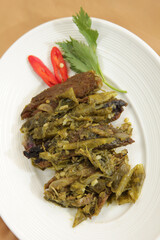 Dendeng balado is a typical cuisine of West Sumatra made from thin and wide slices of beef that are dried and then fried dry. This fried meat is seasoned with green chilli 