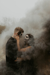 Obraz premium Couple in love in black smoke halloween