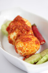 Balado Egg is one of the typical Minangkabau cooking techniques (living in the province of West Sumatra) by sauteing ground chili with various spices, generally shallots, garlic and lime. 