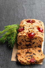 Mixed fruit loaf cake on black stone table