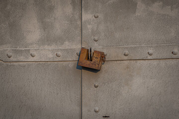 old rusty gates with padlocks