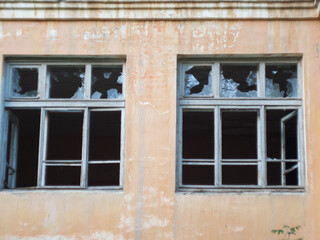 broken Windows after the bombing and fire. airstrike. broken Windows. abandoned areas of military...