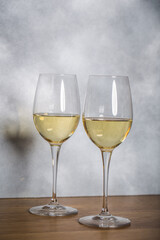 Glass of white wine on vintage wooden table