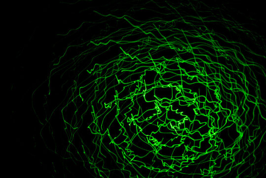 Abstract Lines Of Green Laser Light On Black Background