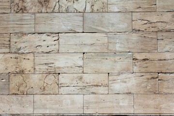 Ancient stone tiles wall vintage background.