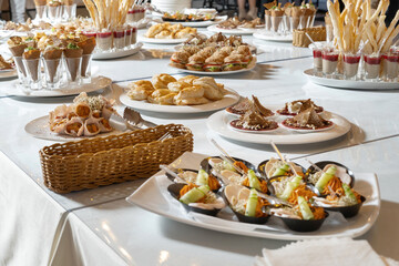 Luxurious catering table.Bacon rolls with delicious filling and sprouted grains. Chicken breast appetizer, with sprouted grains and sauce-2.