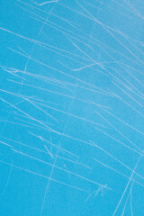 blue surface with white scratches