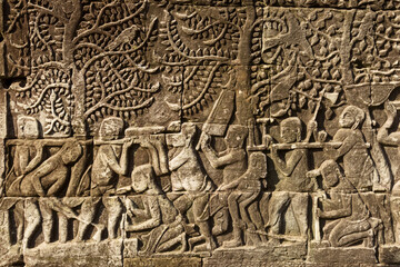 Detail of bas relief depicting a cut wood scene on the Bayon, Angkor Thom, Siem Reap
