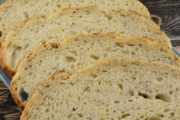Close up of sourdough bread slices on plate on table