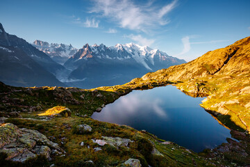 Mighty Mont Blanc glacier with lake Lac Blanc. Location Chamonix resort, Graian Alps, France, Europe.