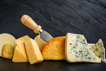 Fototapeta premium cheese many different types and grades hard and soft with mold meal on the table tasty serving size portion top view copy space for text food background rustic