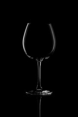 Empty wine glass isolated on black background