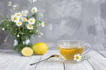 cup of tea and chamomile flowers