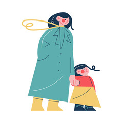 Young smiling woman mother holding hand of her small daughter during walk