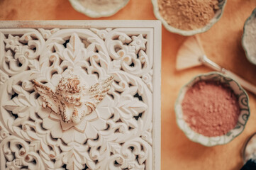 massage aroma therapy salon with essential oils and vintage decorations in natural light and warm tones