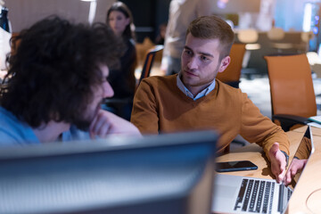 Meeting of co-workers and planning next steps of work. Young business group in discussion in their office. Startup people working in office.