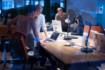 Meeting of co-workers and planning next steps of work. Young business group in discussion in their office. Startup people working in office.