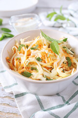 Coleslaw salad with carrots, mint and spicy sauce