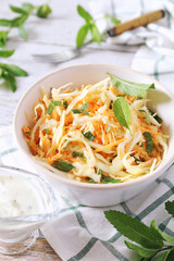 Coleslaw salad with carrots, mint and spicy sauce