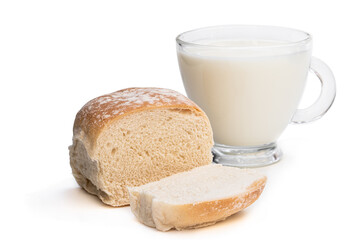Freshly baked wheat bun and glass of milk isolated on white