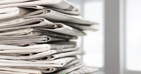 Pile of newspapers stacks on blur background