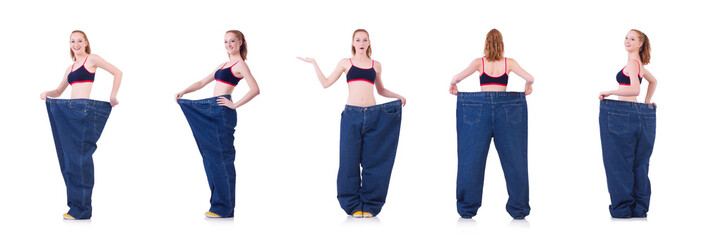 Woman with large jeans in dieting concept