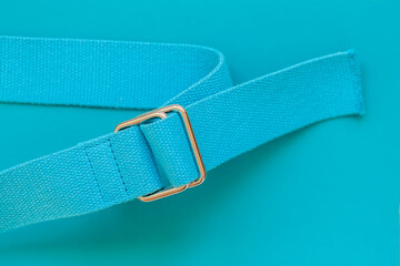 Rough jute sackcloth belt, bluish turquoise color with silver metal fittings on the same color...