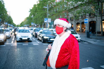 Santa Claus walking through the streets of the city of Madrid